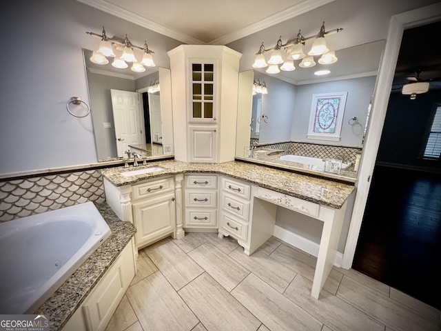 bathroom with vanity, a bath, and ornamental molding