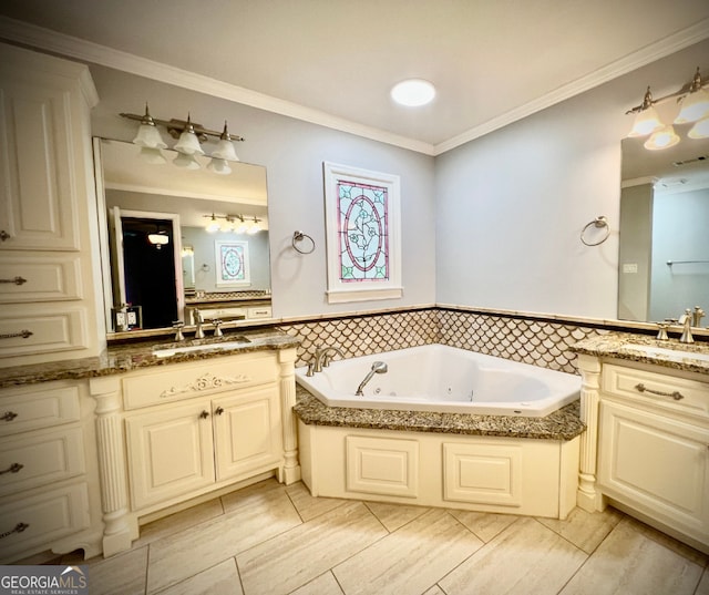 bathroom featuring crown molding, a bathing tub, and vanity