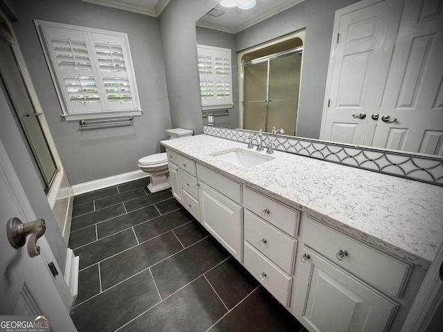 bathroom featuring vanity, toilet, ornamental molding, and tile patterned flooring