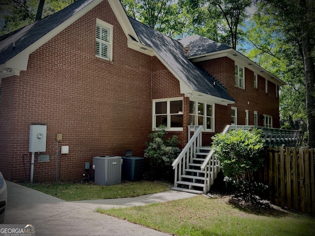 view of side of home featuring central air condition unit