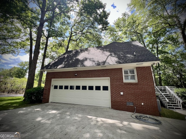 view of side of home with a garage