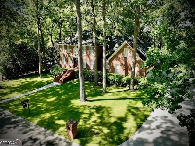 exterior space with a playground and a front lawn