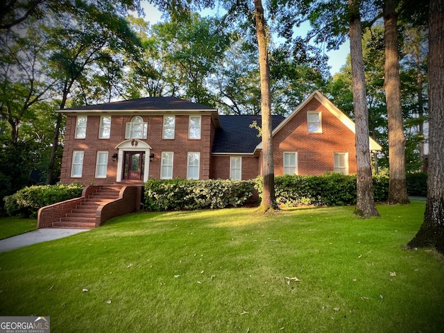 colonial home with a front yard