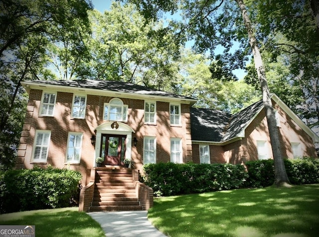 view of front of home with a front yard