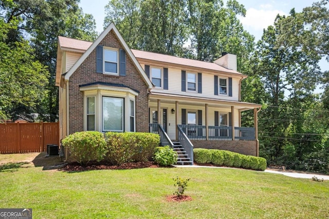 view of front of house with a front lawn and covered porch