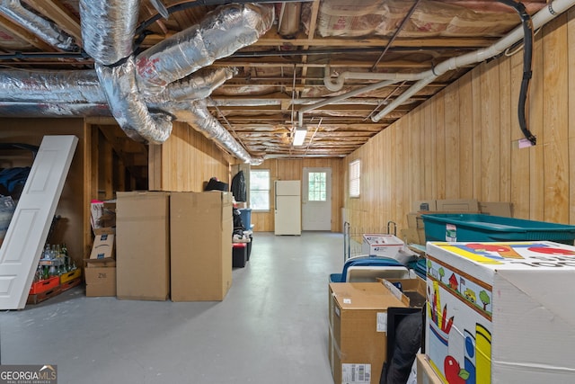 basement featuring white fridge