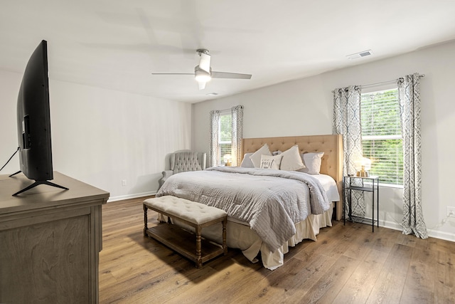 bedroom with hardwood / wood-style floors and ceiling fan