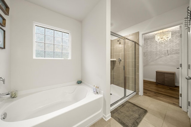 bathroom featuring tile patterned flooring and independent shower and bath