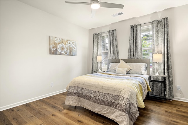 bedroom with ceiling fan and hardwood / wood-style flooring