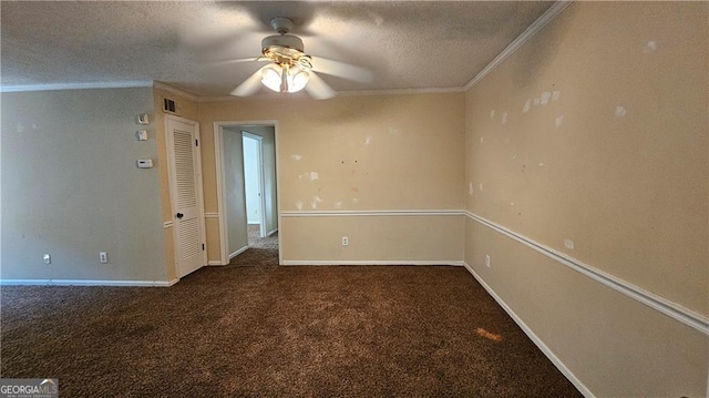 carpeted empty room featuring crown molding, ceiling fan, and a textured ceiling