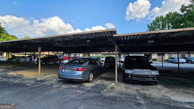 view of vehicle parking with a carport