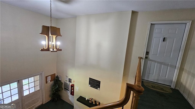 foyer entrance with a chandelier