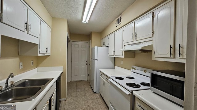 kitchen with sink, white cabinets, a textured ceiling, and appliances with stainless steel finishes