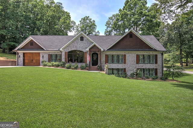 craftsman-style home featuring a front yard and a garage