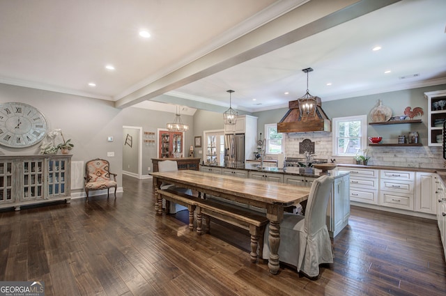 dining room with french doors, crown molding, and dark wood-type flooring