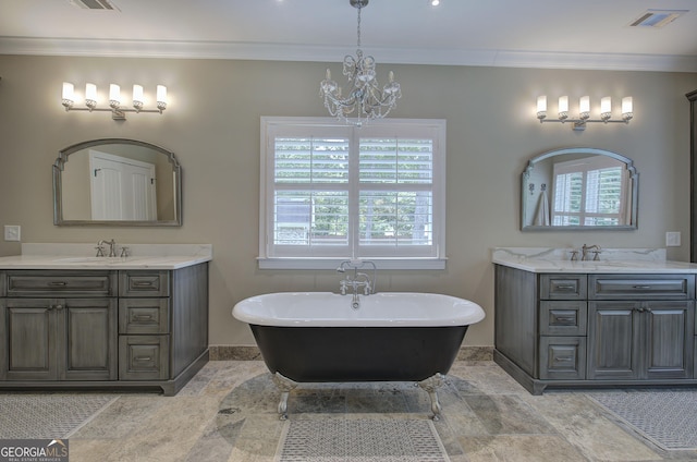 bathroom with a bathing tub, vanity, ornamental molding, and an inviting chandelier