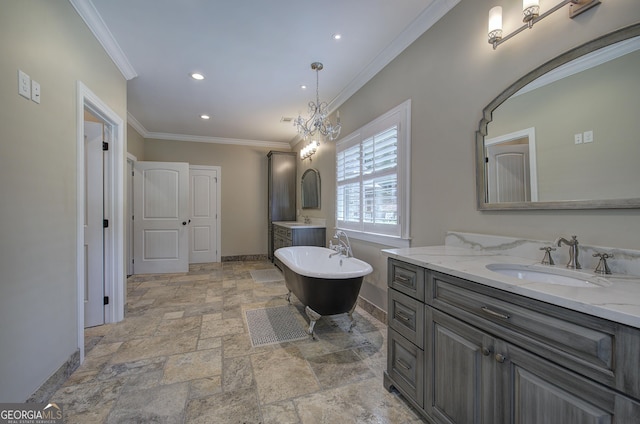 bathroom with a bathing tub, vanity, crown molding, and a chandelier