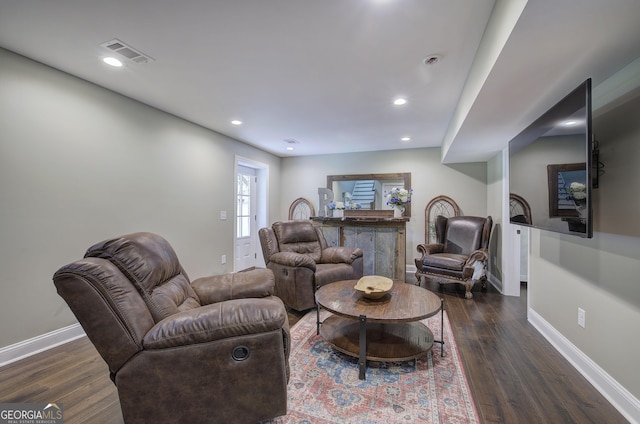 living room with dark hardwood / wood-style floors