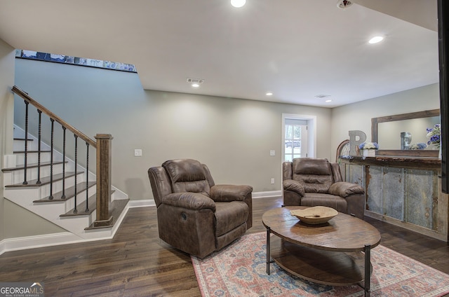 living room with dark hardwood / wood-style floors