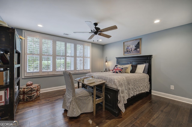 bedroom featuring dark hardwood / wood-style floors and ceiling fan