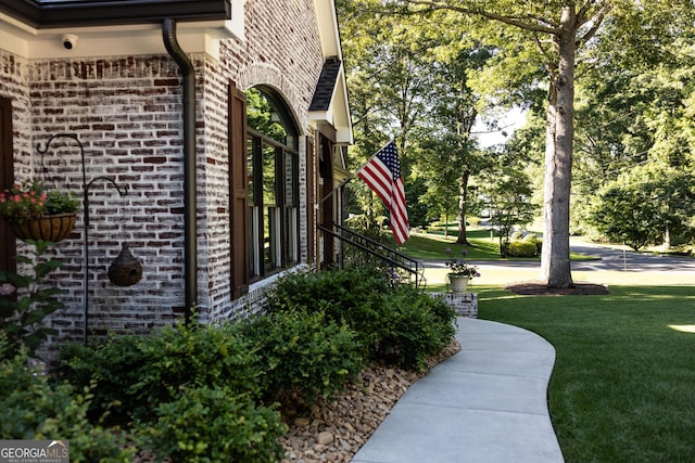 view of home's exterior with a yard