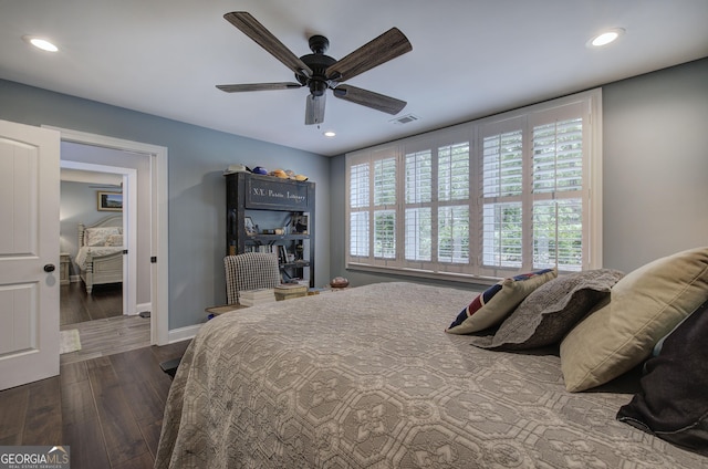 bedroom featuring ceiling fan and dark wood-type flooring