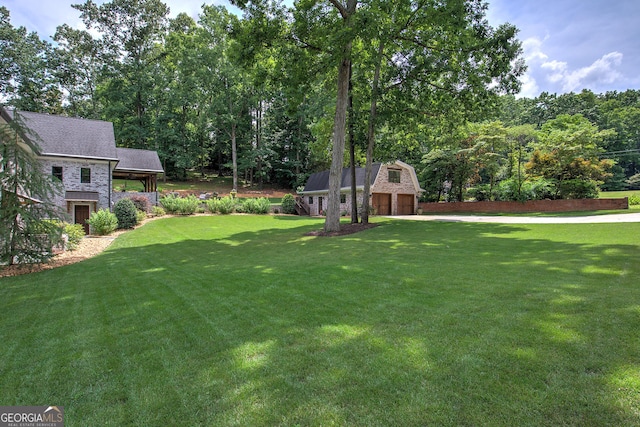 view of yard featuring a garage