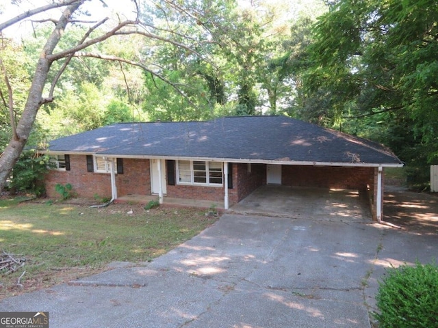 single story home featuring a carport