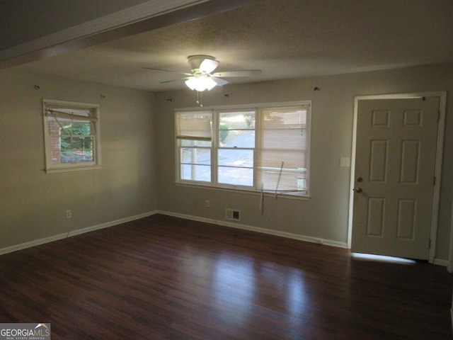 foyer entrance with ceiling fan and dark hardwood / wood-style floors