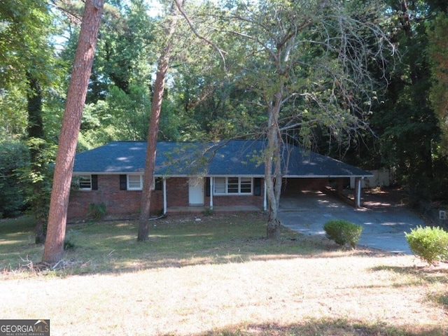 ranch-style house with a front lawn and a carport