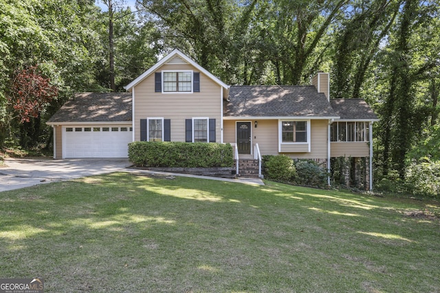 view of front facade with a garage, a front lawn, and a sunroom