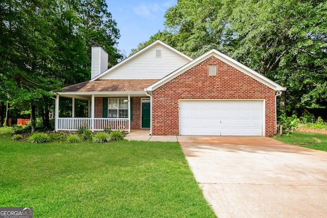 view of front of home featuring a garage, a porch, and a front lawn