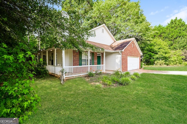 view of front facade with a garage, covered porch, and a front lawn