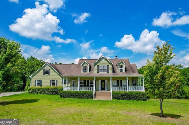 new england style home featuring covered porch and a front lawn