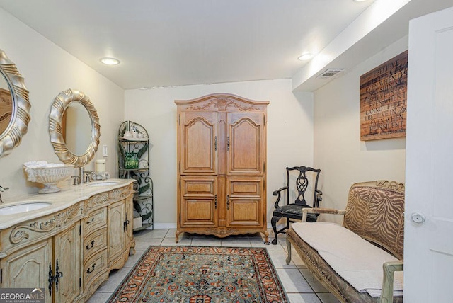 bathroom with tile patterned flooring and vanity