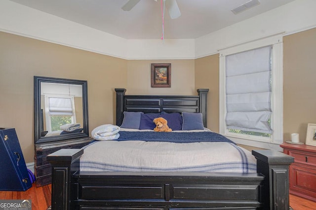 bedroom with wood-type flooring and ceiling fan