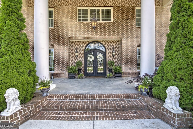 property entrance featuring french doors