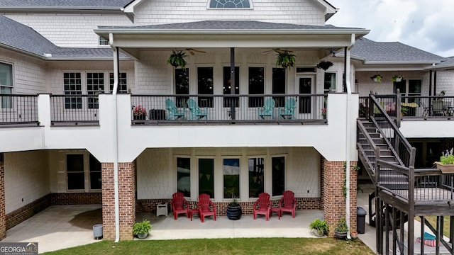 back of property featuring a patio area and ceiling fan