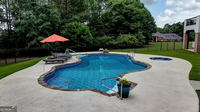 view of pool with a yard and a patio