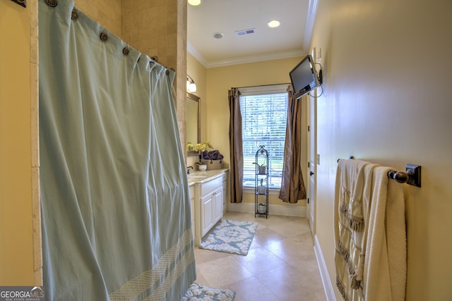 bathroom with crown molding and vanity