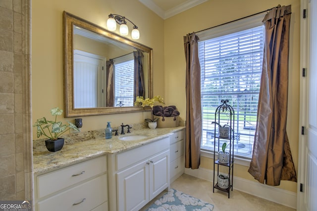 bathroom featuring tile patterned floors, vanity, and ornamental molding