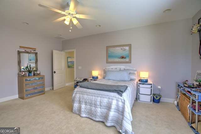 carpeted bedroom with ceiling fan