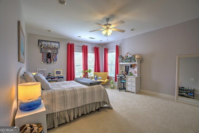 carpeted bedroom with ceiling fan