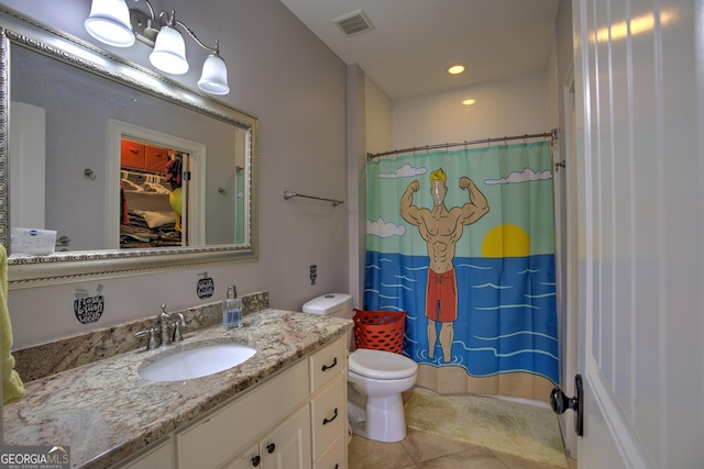 bathroom with a shower with curtain, toilet, tile patterned flooring, and vanity