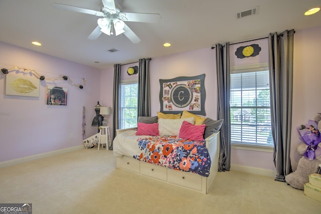 bedroom featuring ceiling fan and light colored carpet