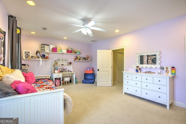 bedroom with ceiling fan and light carpet