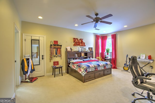 bedroom featuring ceiling fan and light colored carpet