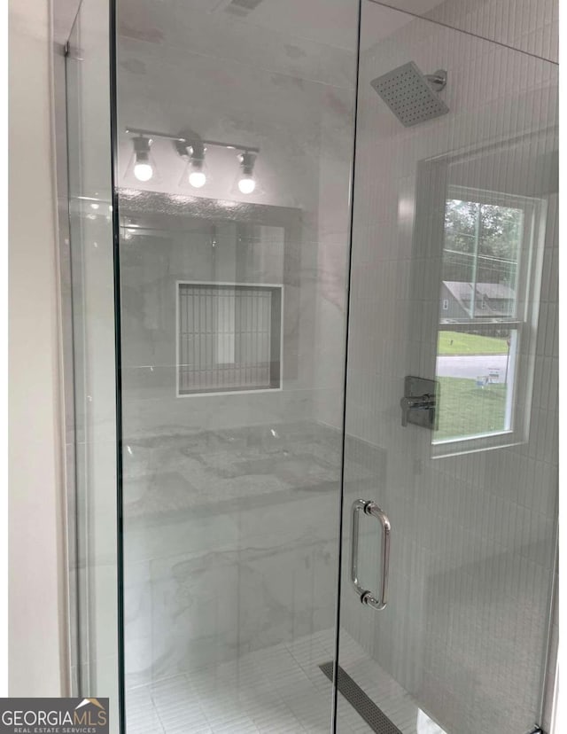 bathroom featuring an enclosed shower