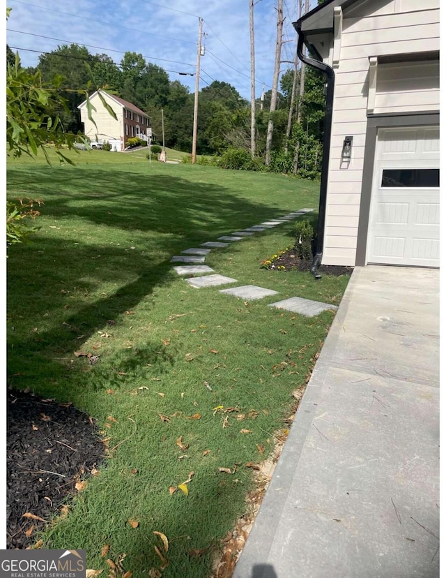 view of yard featuring a garage