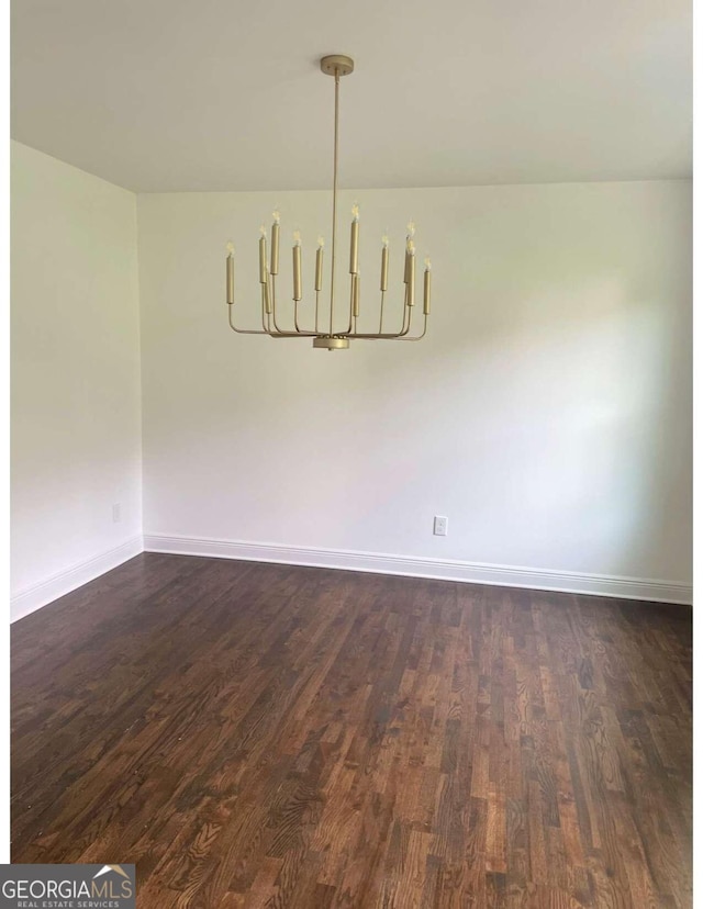 unfurnished room featuring dark wood-type flooring